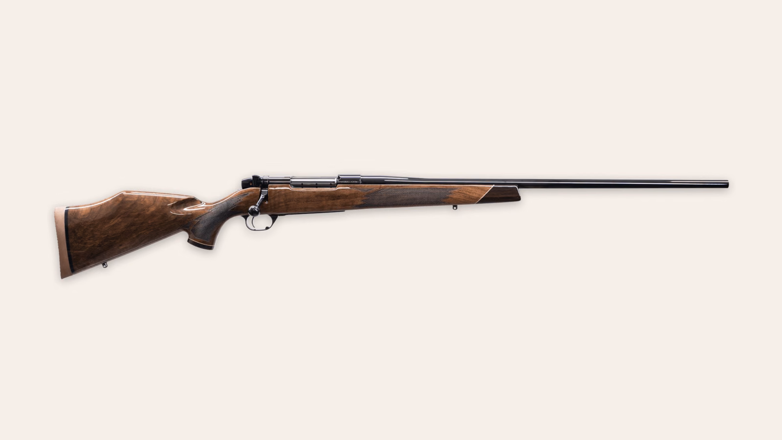 Weatherby Mark V Deluxe gloss-walnut rifle in side profile